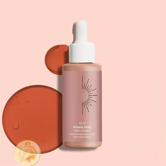 Skincare dropper bottle with a pink label on a peach background